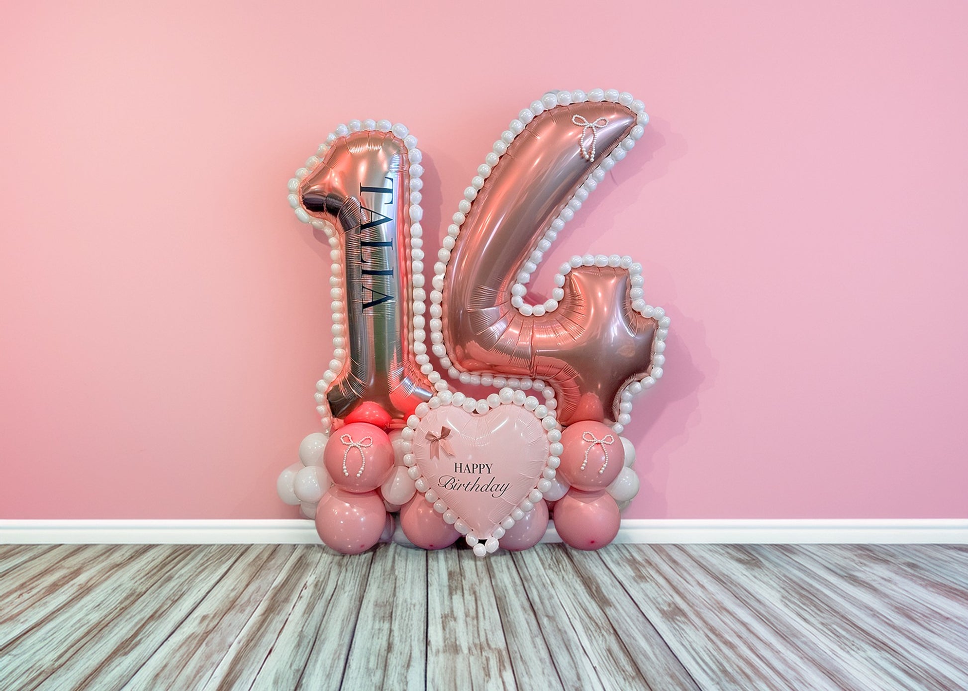 Coquette Balloon Stand Toronto – Luxury pink and white 14th birthday balloon stand with heart balloon and elegant bow accents by Wooow Balloons Toronto.