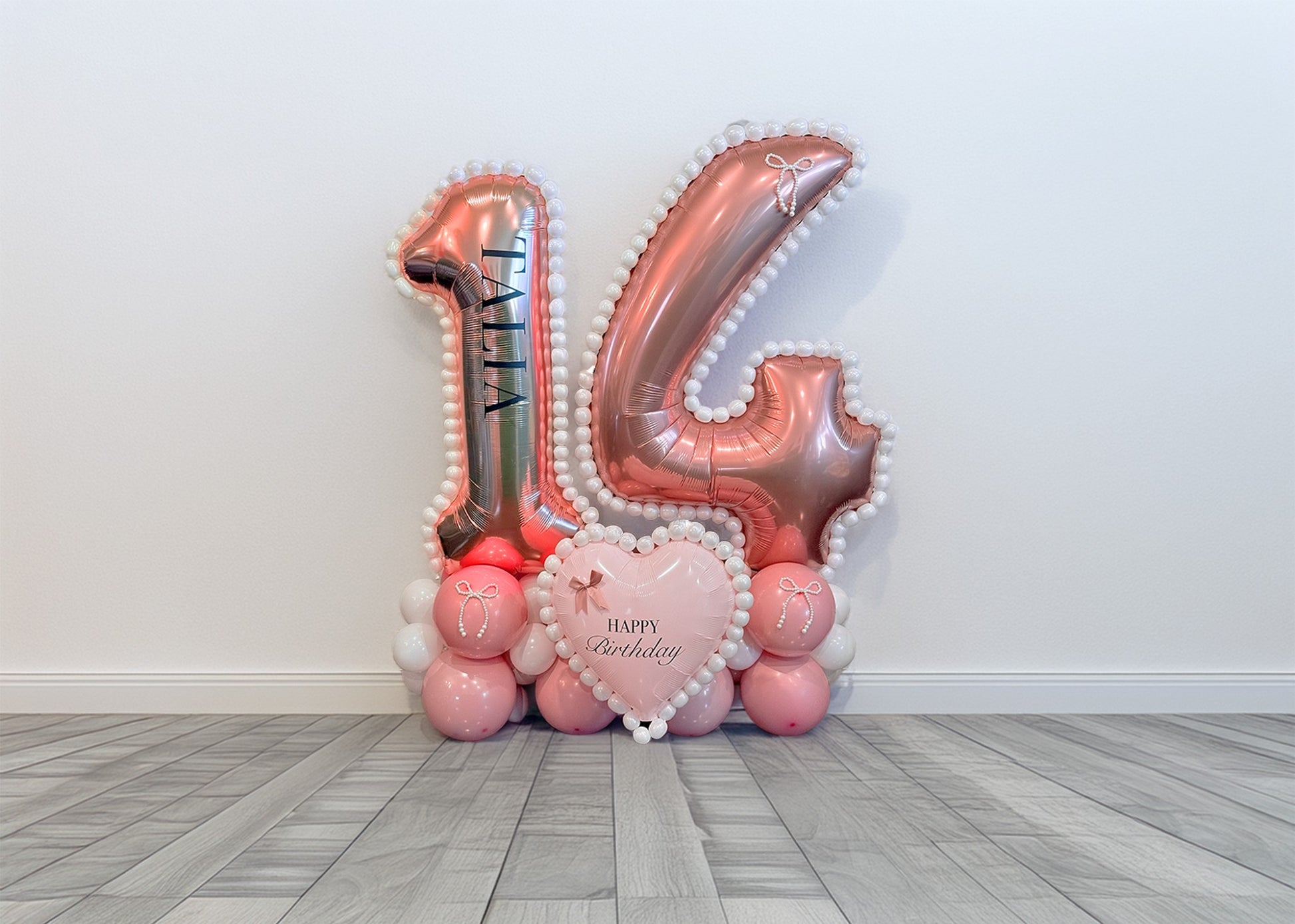 Coquette Balloon Number Display Toronto – Elegant pink and white number balloon arrangement with pearl details by Wooow Balloons Toronto.