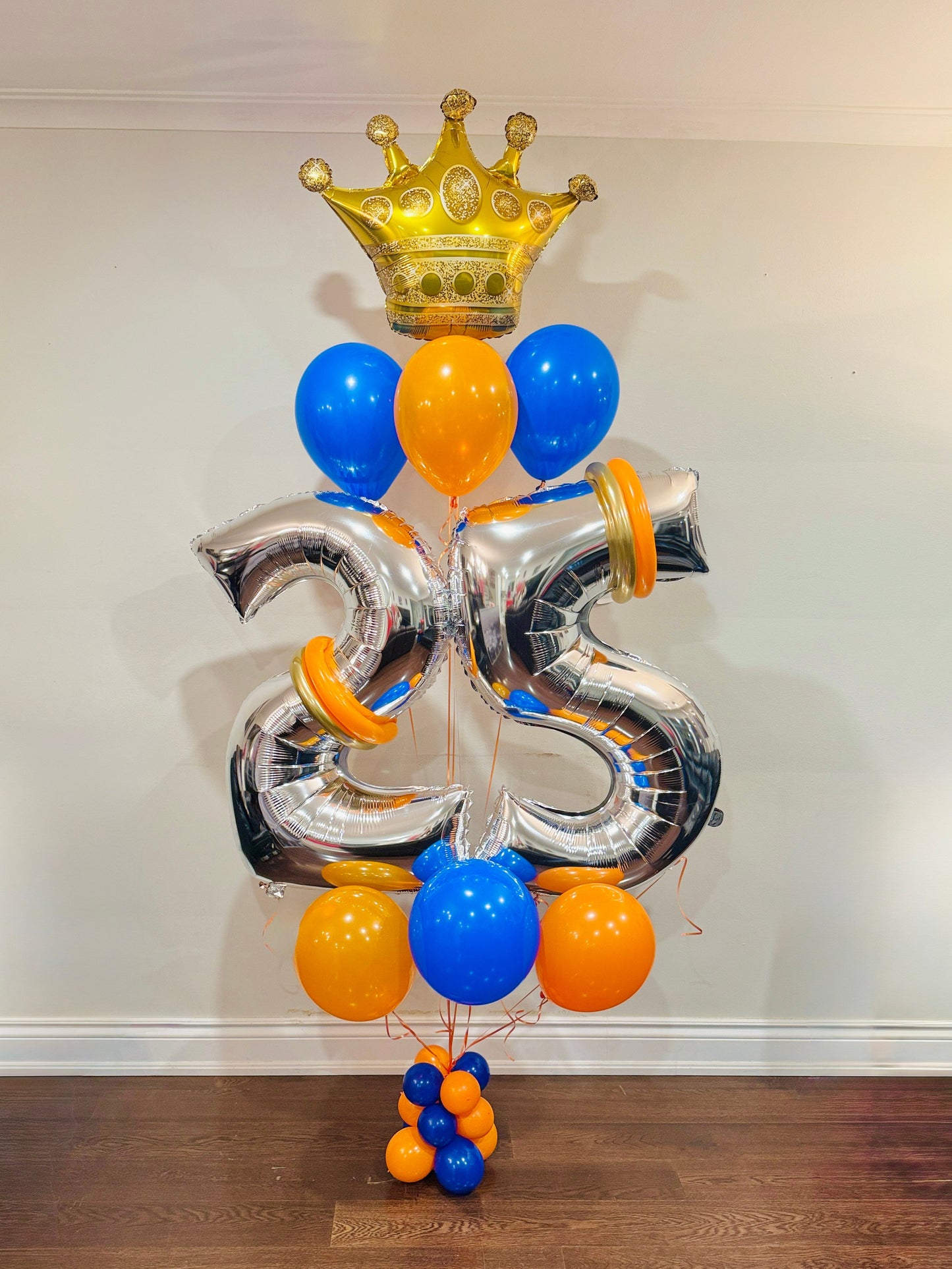 Balloon bunch with crown balloon and milestone numbers by Wooow Balloons Toronto