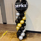 Balloon column with Sysco Perks Premier Club logo in a room.