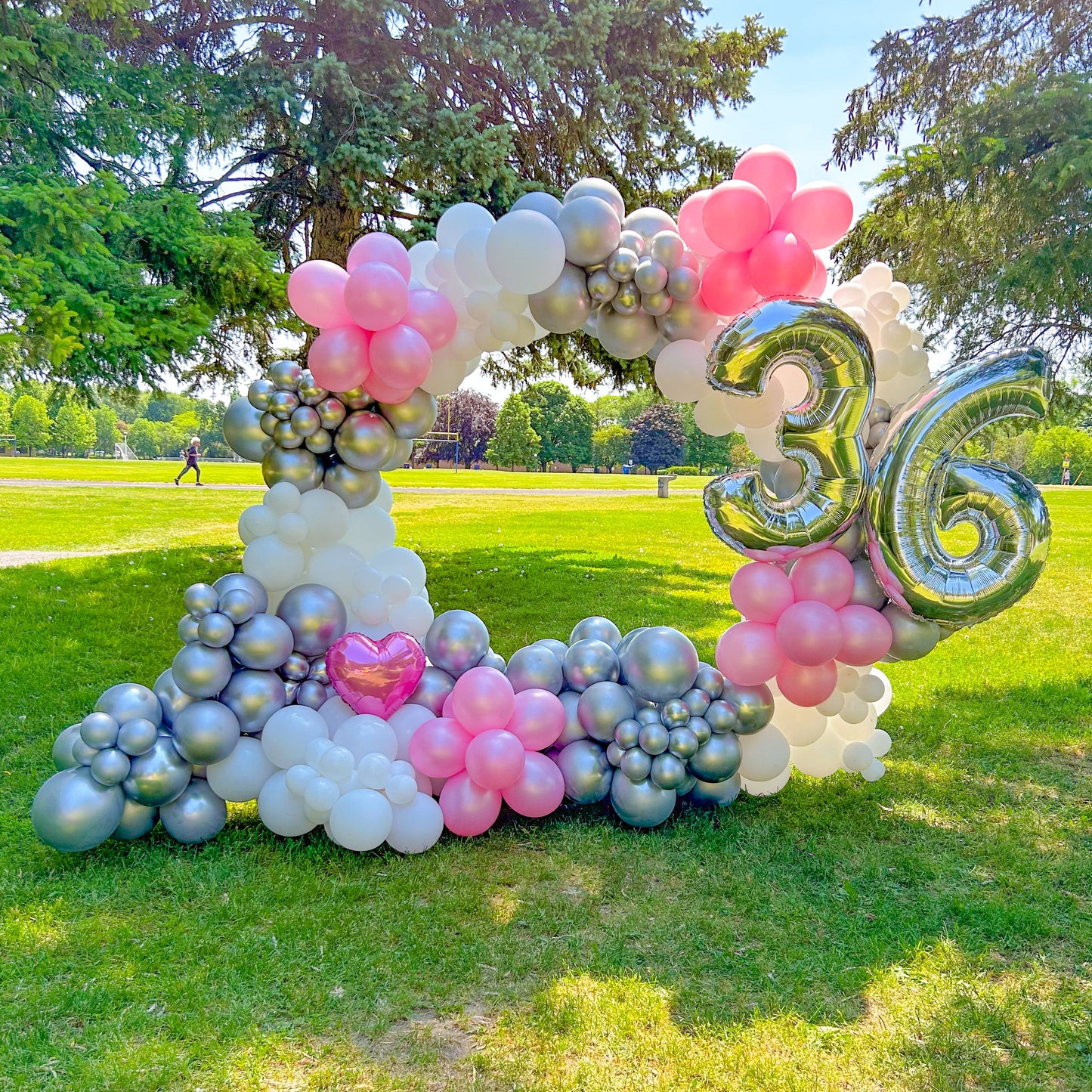 Full Balloon Arch in Toronto featuring a gold metal frame and biodegradable balloons for events.
