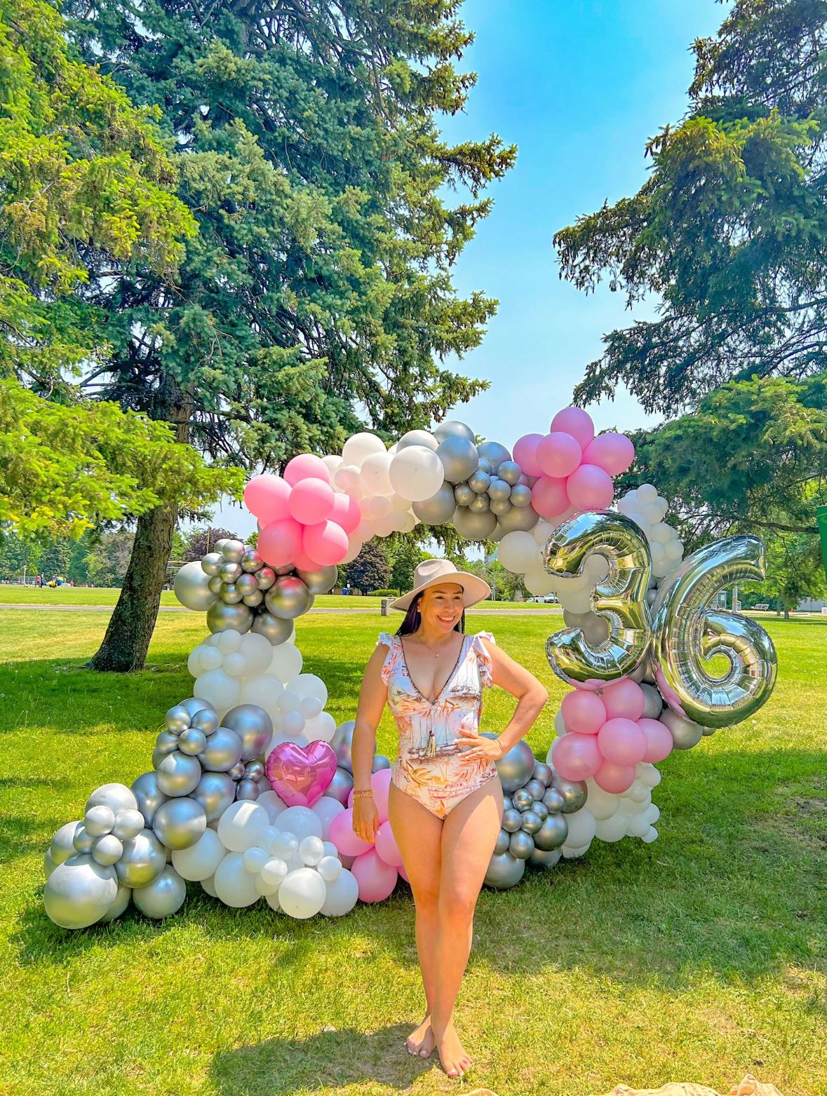 Full Balloon Arch in Toronto featuring a gold metal frame and biodegradable balloons for events.
