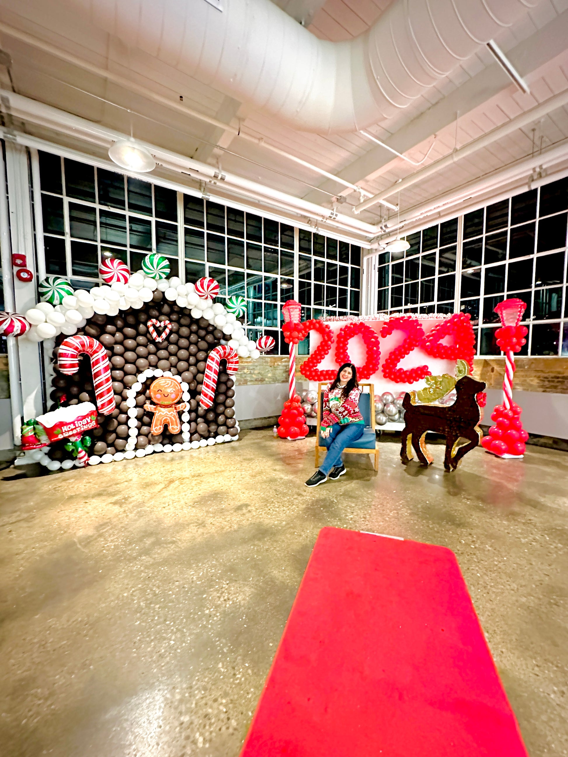Gingerbread Balloon House with festive balloons and holiday decorations.