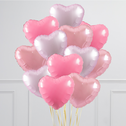 A bouquet of colorful 17-inch helium-filled heart balloons in various colors.