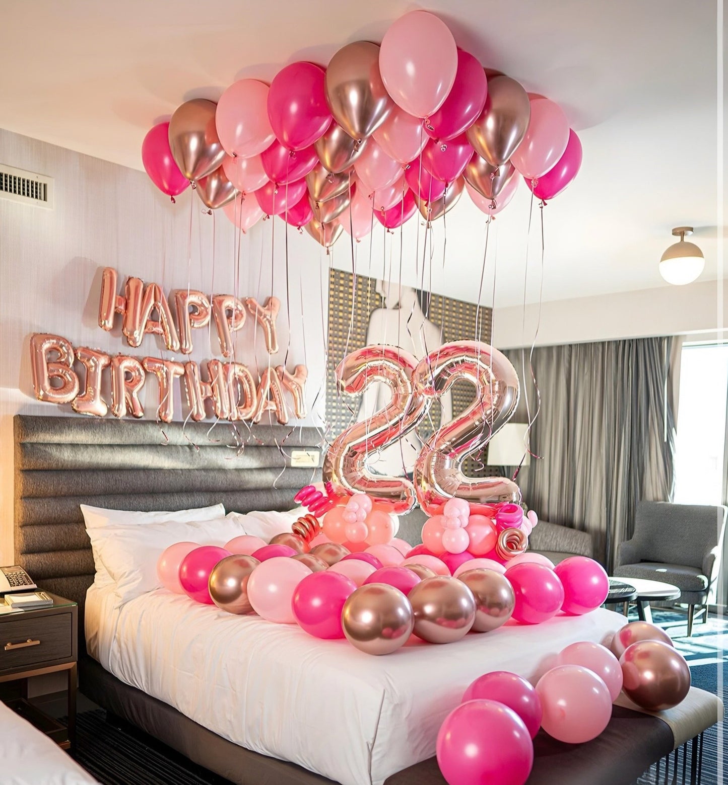 Hotel Room Birthday Balloon Decoration Toronto – Elegant pink and rose gold balloons with ceiling decor and number balloons by Wooow Balloons Toronto.