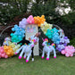 Magical Unicorn Balloon Backdrop with a pastel rainbow balloon arch and inflatable unicorn decorations for a kids’ party.