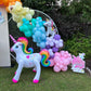 Magical Unicorn Balloon Backdrop with a pastel rainbow balloon arch and inflatable unicorn decorations for a kids’ party.