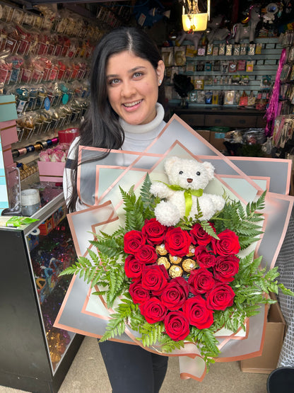 Heart-shaped bouquet with fresh red roses, Ferrero Rocher chocolates, and a teddy bear.