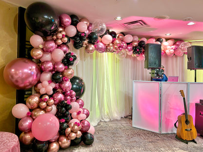 Luxury Balloon Garland featuring pink, black, and rose gold balloons with floral accents, perfect for elegant events and celebrations.