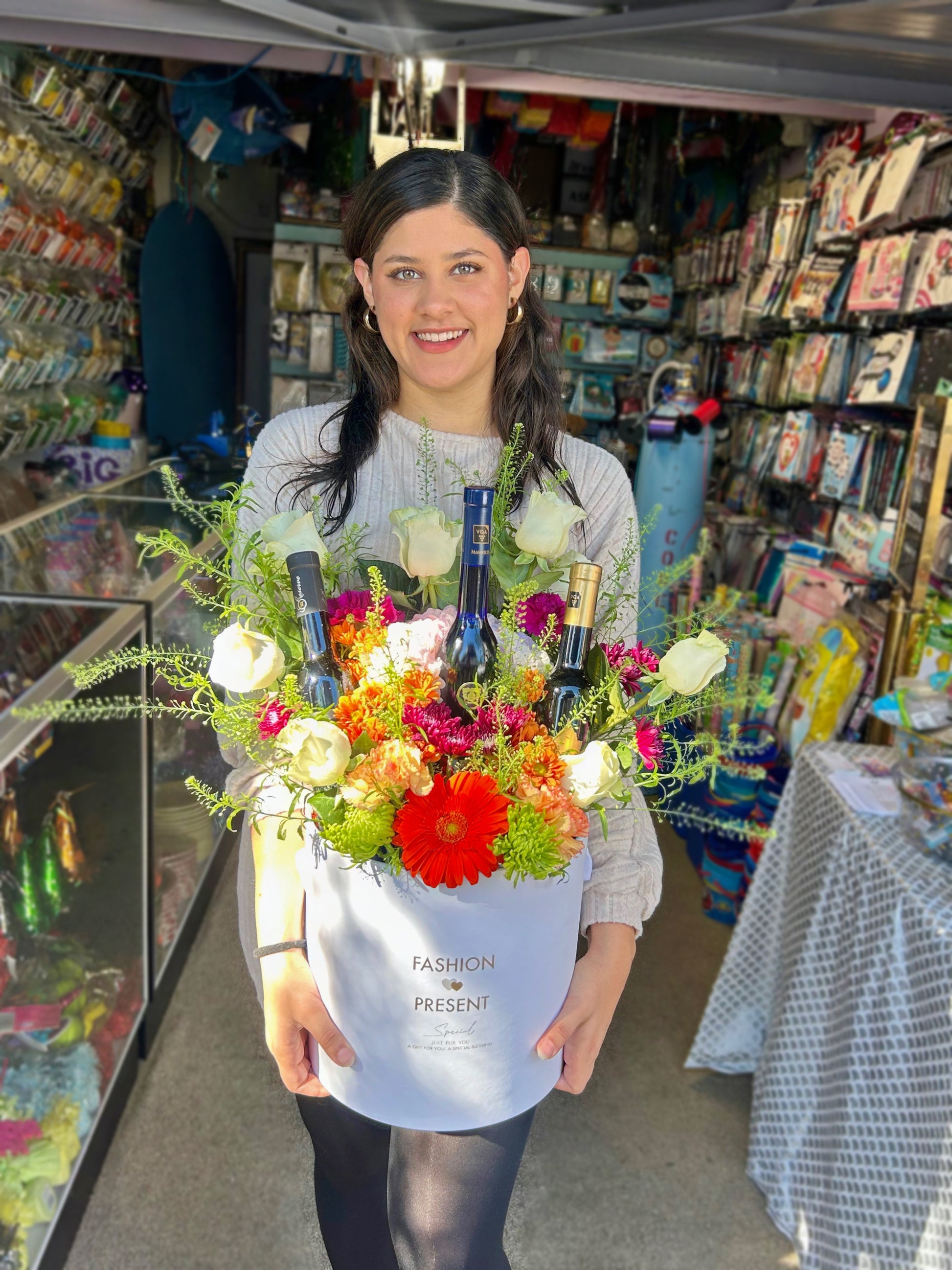 Luxury Floral & Wine Arrangement with 3 wine bottles and seasonal flowers in a stylish bucket