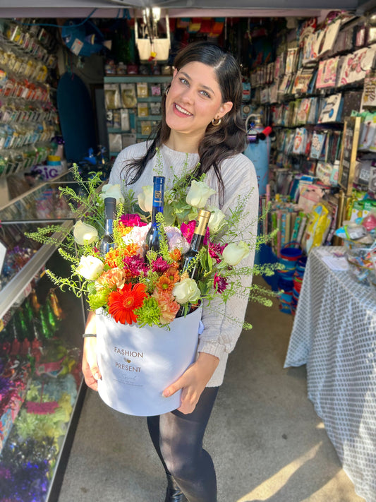Luxury Floral & Wine Arrangement with 3 wine bottles and seasonal flowers in a stylish bucket