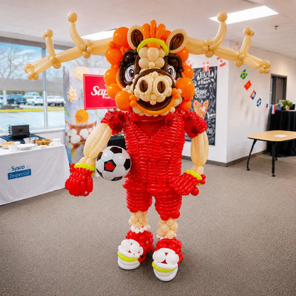 Custom Maple Moose balloon sculpture created by Wooow Balloons for a Sysco corporate event in Toronto. Handcrafted life-size balloon mascot featuring a red soccer uniform, maple-inspired design, and premium balloon artistry.