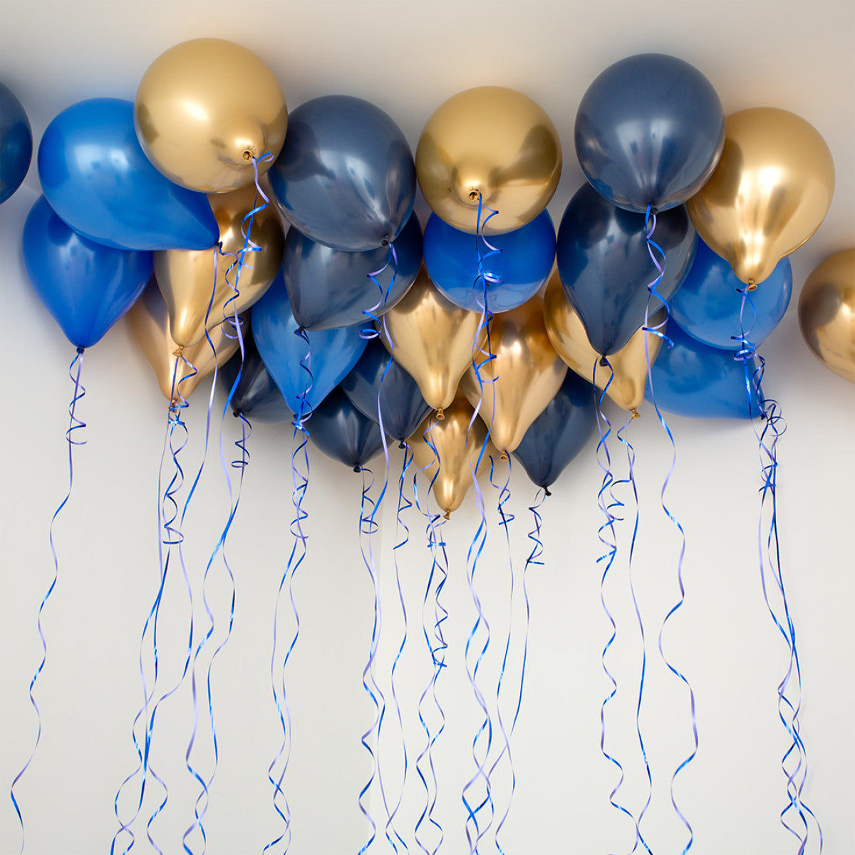 Blue, gold, and silver balloons with ribbons for New Year in Toronto
