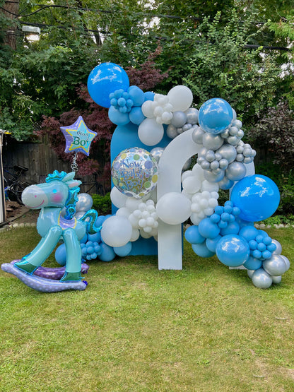 New Baby Born Balloon Decor setup with blue and silver balloons and a rocking horse balloon in Toronto