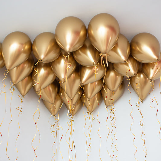Gold balloons with ribbons for New Year's Toronto.