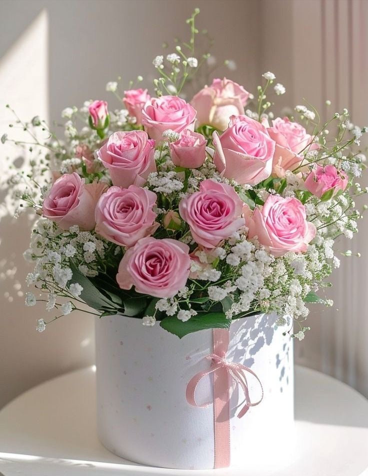 Luxury soft pink roses box arrangement for special occasions with wet oasis for freshness.