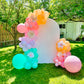 Spring Decor Setup with biodegradable balloon garlands and a festive backdrop.

