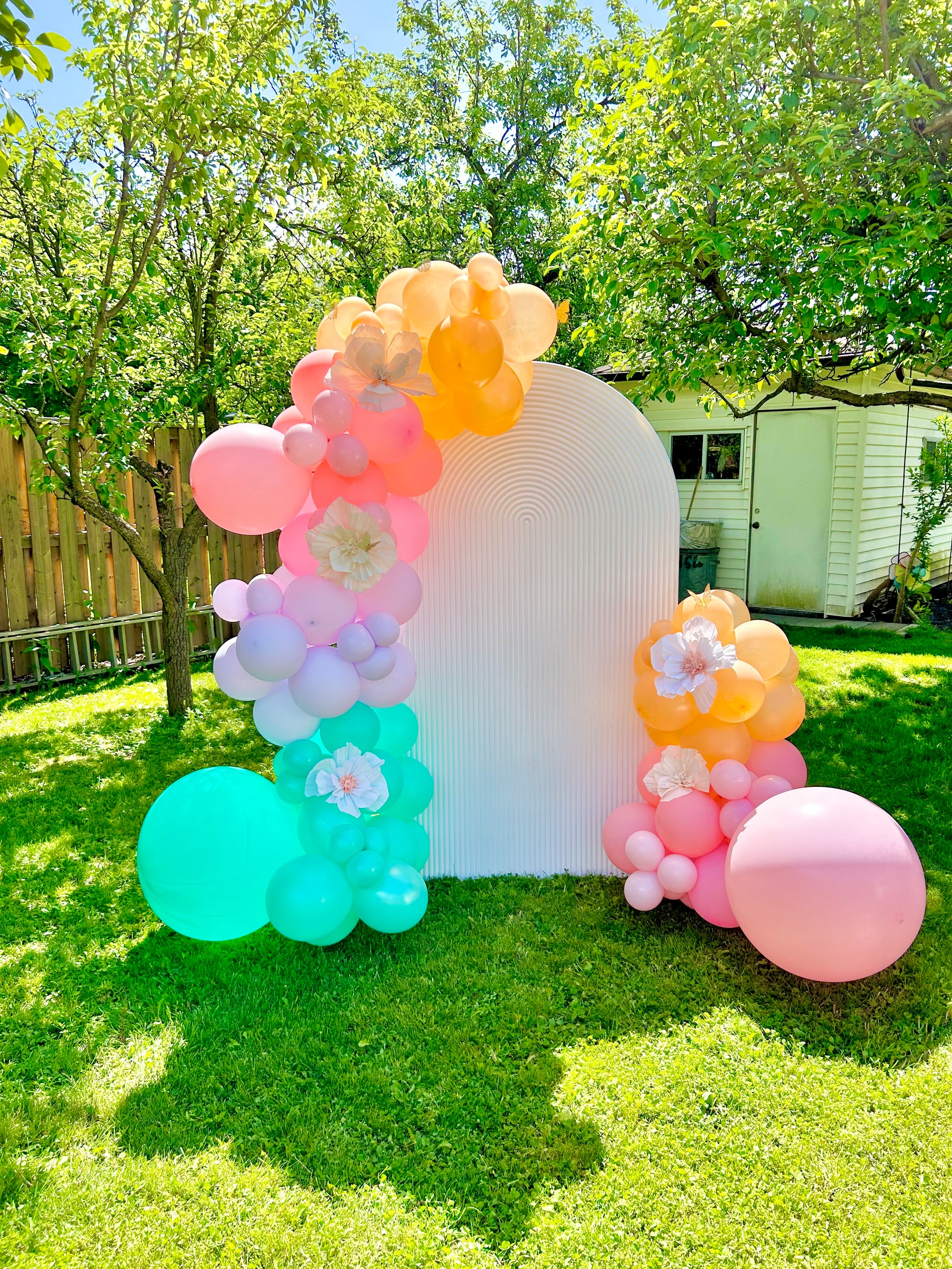 Spring Decor Setup with biodegradable balloon garlands and a festive backdrop.


