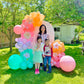 Spring Decor Setup with biodegradable balloon garlands and a festive backdrop.