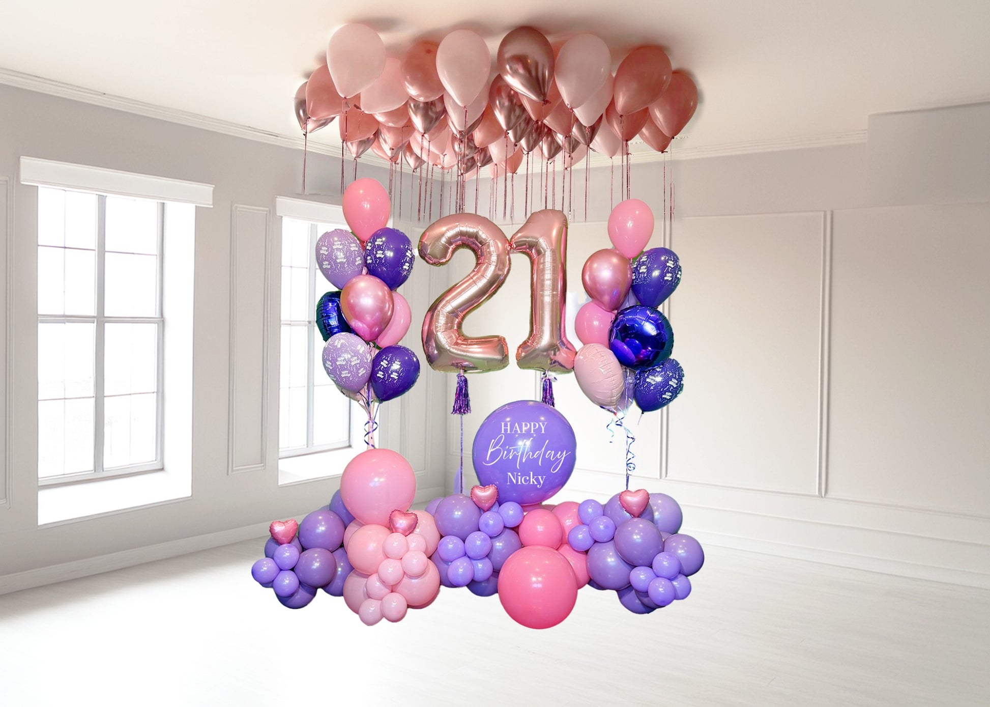 Custom birthday balloon setup with number balloons, garland, and bouquets in pink and purple tones – Wooow Balloons Toronto
