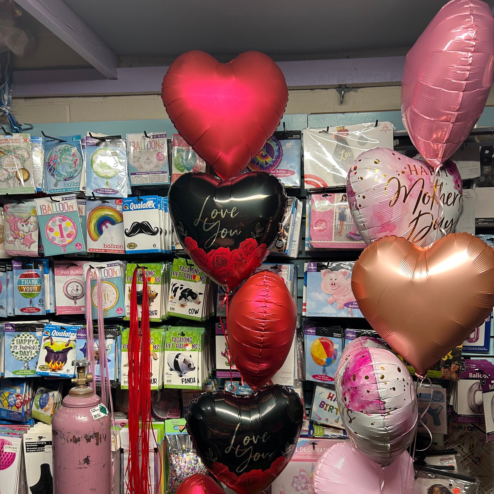 A beautifully wrapped Surprise Balloon Gift Box with 5 helium-filled balloons inside, perfect for celebrations, birthdays, and gender reveals.