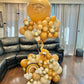 Teddy Bear Balloon Arrangement featuring a balloon display with a teddy bear and elegant balloon clusters, ideal for baby showers and newborn celebrations.
