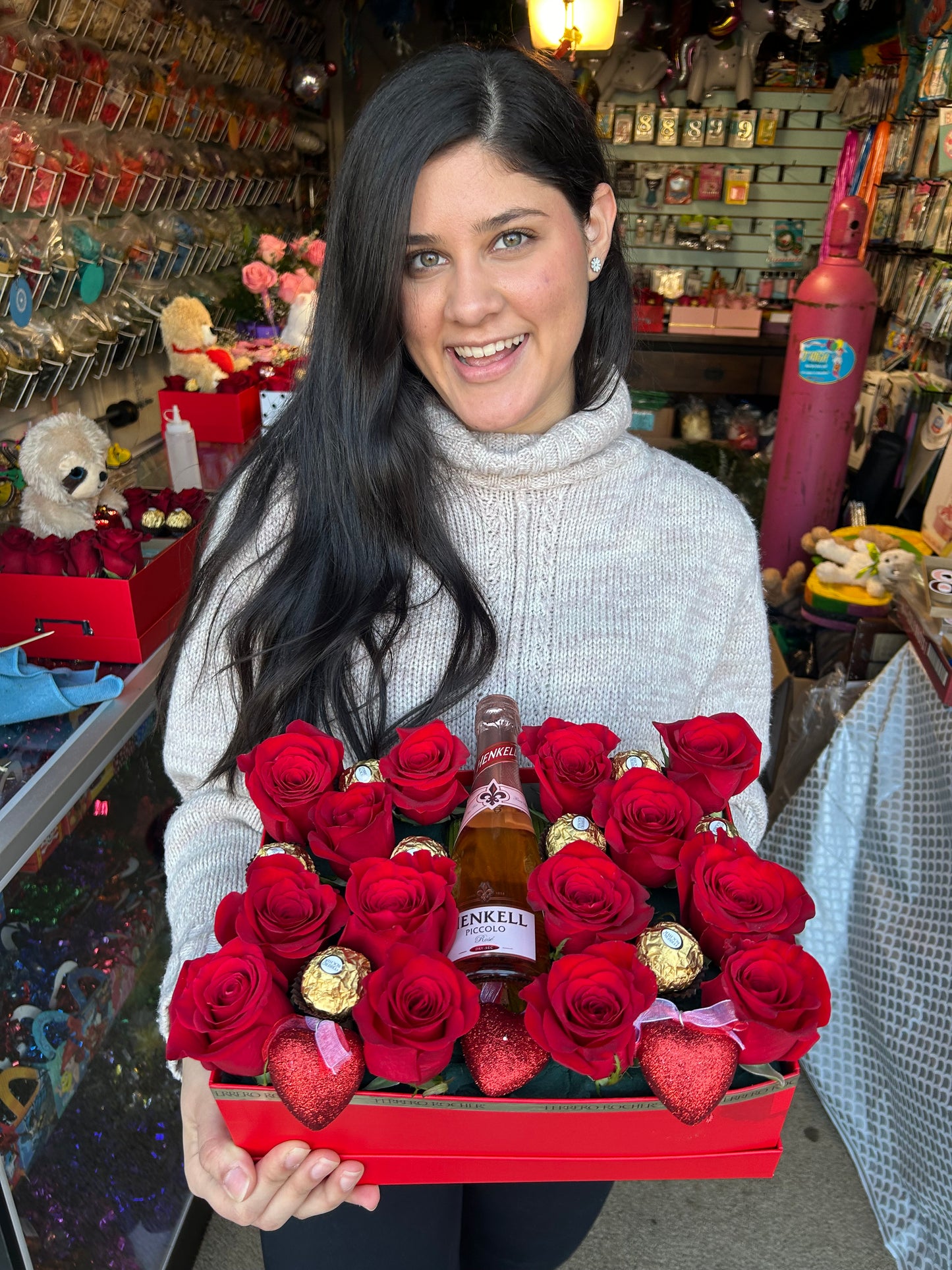 The Flower Box with fresh red roses, Ferrero Rocher chocolates, and a mini bottle for special occasions.