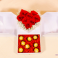 Elegant White Heart Box with fresh red roses and Ferrero Rocher chocolates in a luxurious white box.