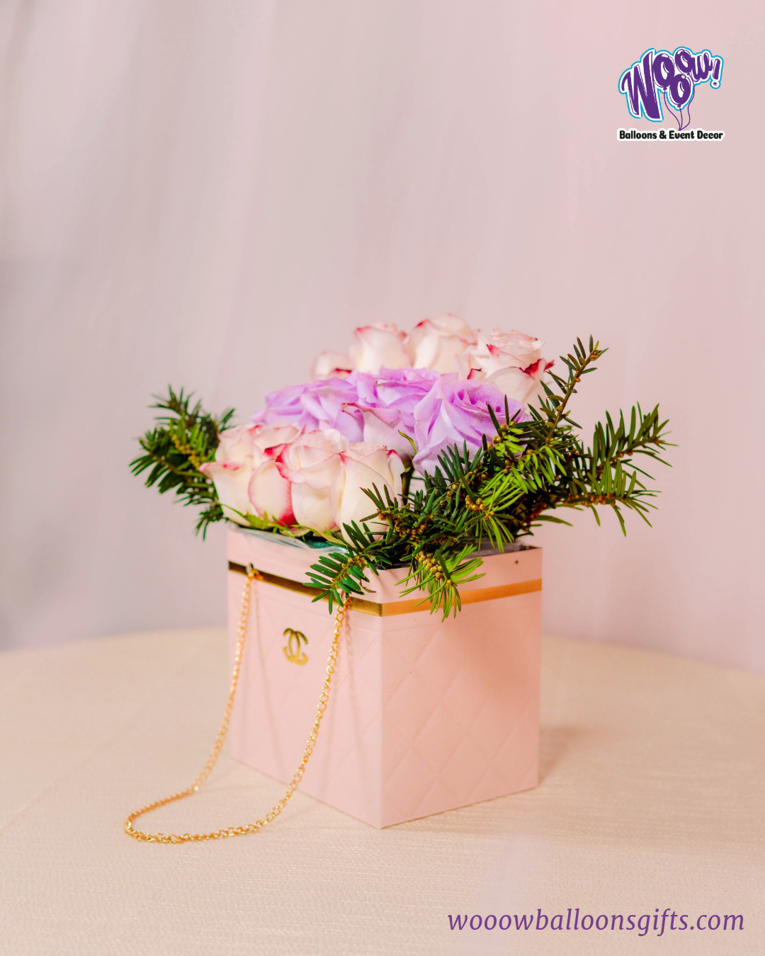 Luxury Bloom Purse with fresh white and lavender roses in a pink quilted handbag-inspired box.