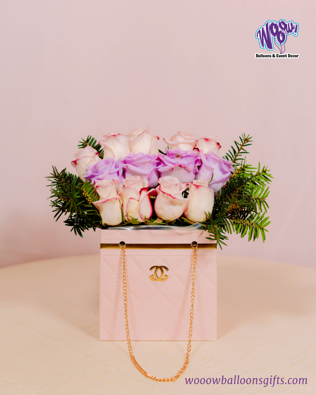 Luxury Bloom Purse with fresh white and lavender roses in a pink quilted handbag-inspired box.