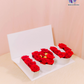 Love Letters Rose Box with fresh red roses and Ferrero Rocher chocolates in a luxury white box.