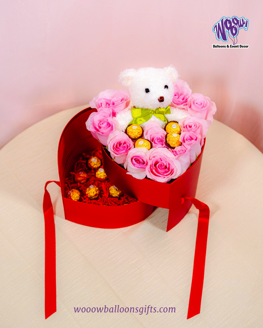 Sweetheart Teddy Box with fresh pink roses, Ferrero Rocher chocolates, and a plush teddy bear in a heart-shaped box.