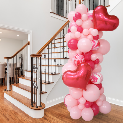 Valentine’s Balloon Garland with heart-shaped foil balloons, biodegradable latex balloons.