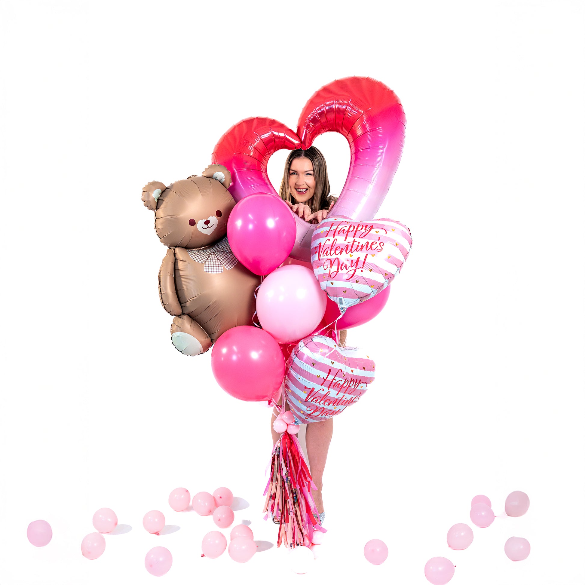 Valentine’s Day balloons in Toronto featuring a teddy balloon, heart supershape, and Valentine heart foil balloons.