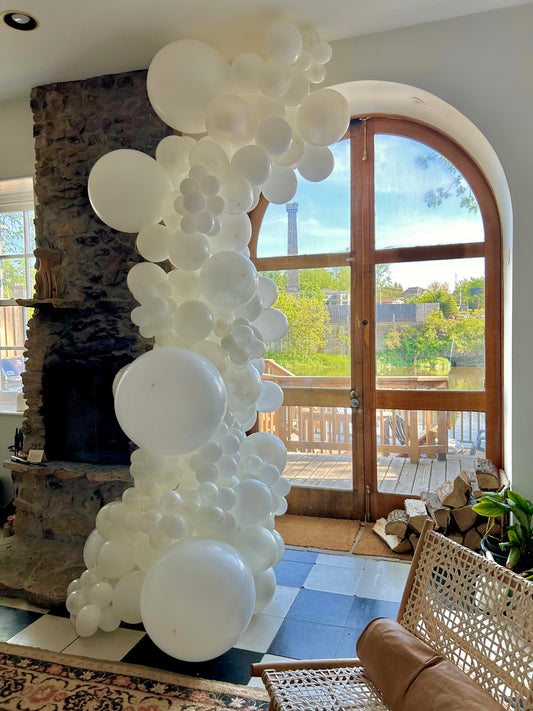 Elegant organic balloon garland in white, designed for luxury home décor, weddings, and stylish event setups.
