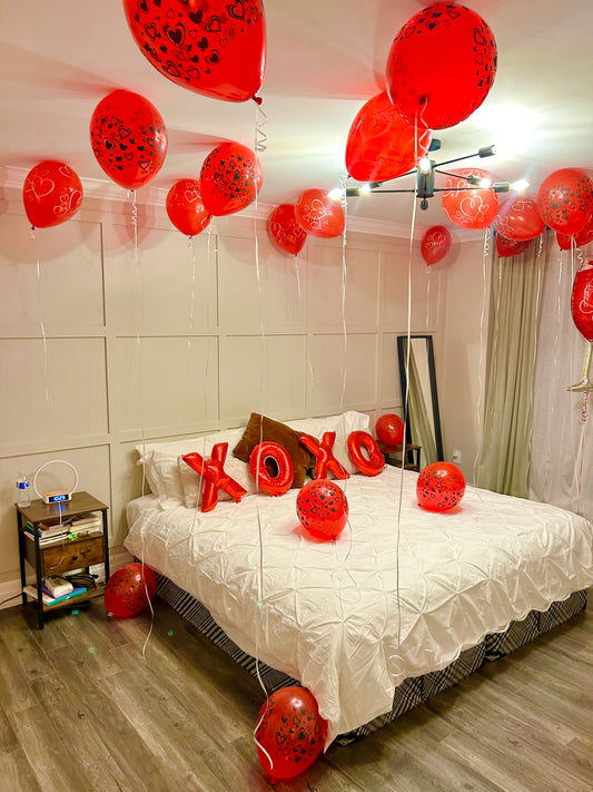 Romantic XOXO Balloon Room Decor with helium balloons and bed decoration