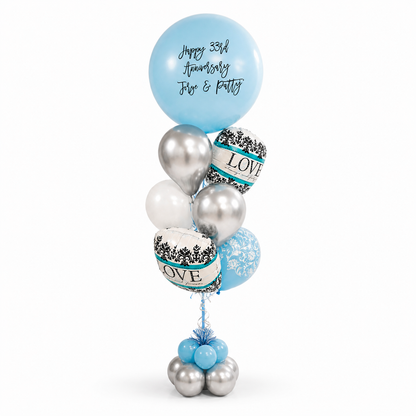 Custom anniversary balloon bouquet with personalized message, blue and silver balloon arrangement for couples in Toronto, luxury balloon delivery for anniversary celebrations and special occasions