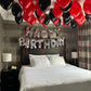 At-home birthday balloon room decoration in red and black colors, Toronto surprise balloon setup by Wooow Balloons