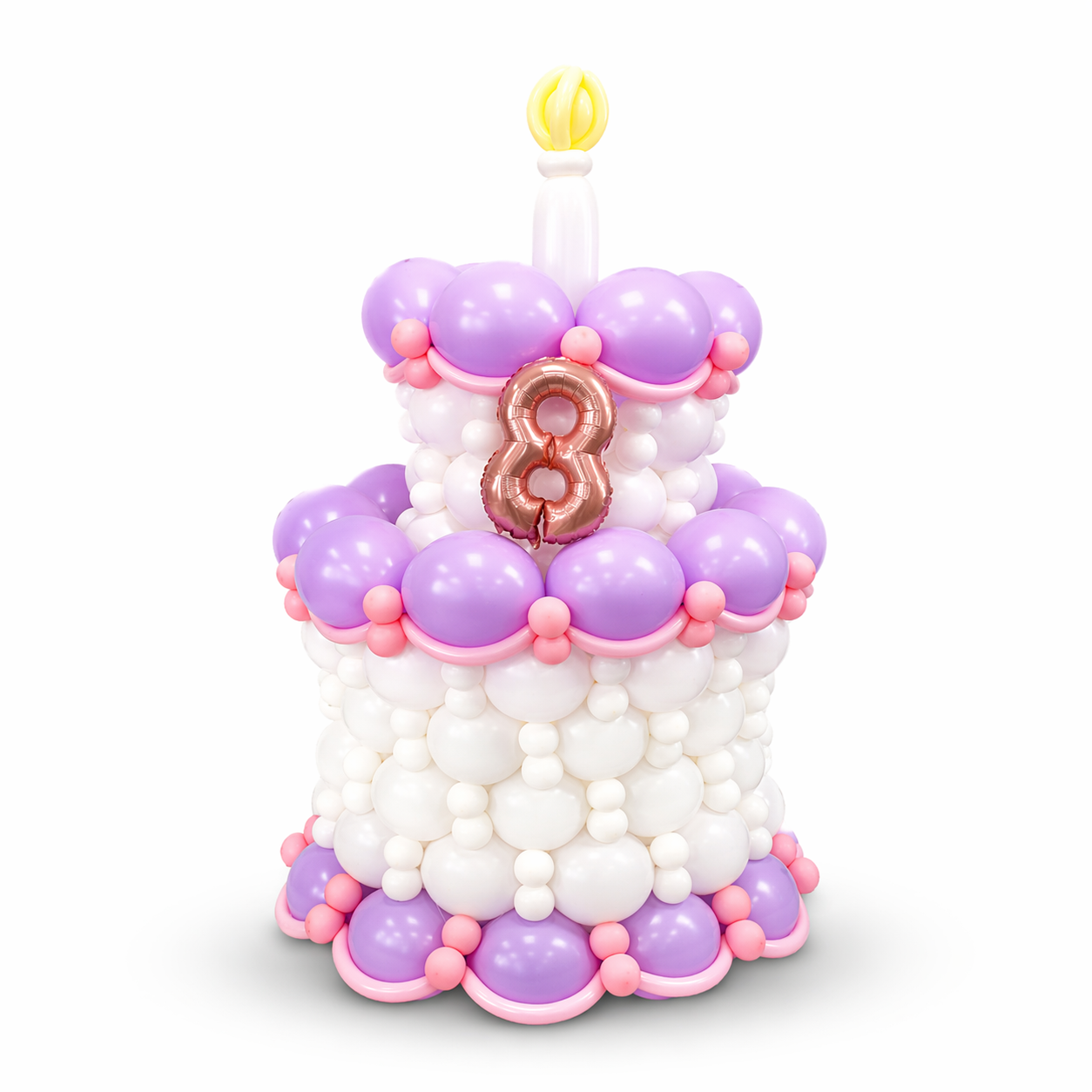 Custom balloon cake centerpiece with personalized number, pastel purple and pink balloon design for birthday celebrations in Toronto