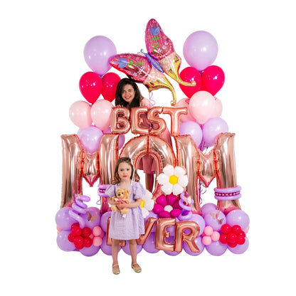 Balloons for Mom Toronto with rose-gold lettering, pastel balloon base and colourful butterfly topper.