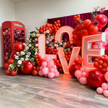 Balloons for Valentine’s Day in Toronto featuring LOVE marquee letters, red balloon decor and romantic photo backdrop