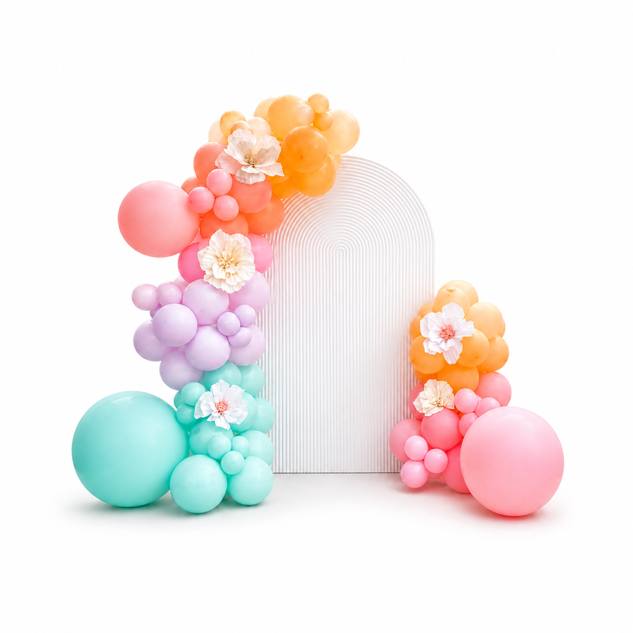 Birthday backdrop with organic balloon garland in pastel colors, custom balloon decor setup for parties in Toronto