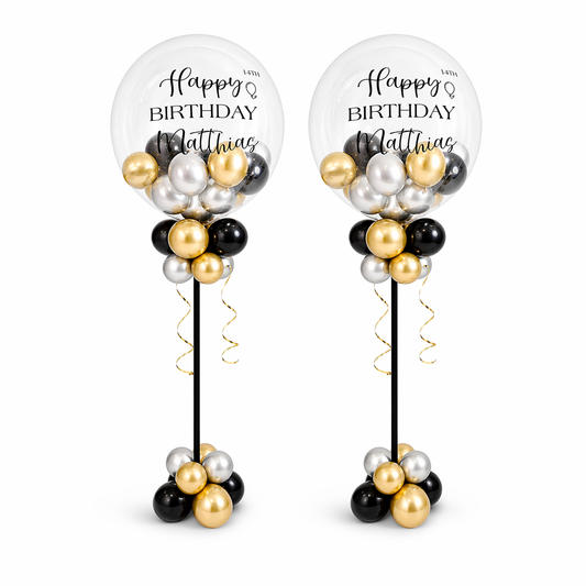 Luxury birthday balloon centerpieces in black, gold, and silver with personalized clear bubble balloons for Matthias 14th birthday in Toronto.