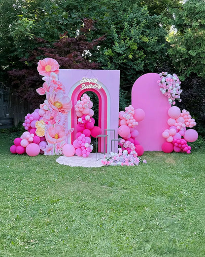 Pink birthday balloon decor in Toronto with floral backdrops, organic balloon garlands and a Happy Birthday photo area by Wooow Balloons.