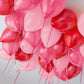 Pink and red ceiling balloons Toronto – Elegant romantic ceiling balloon installation for birthdays and hotel room decor by Wooow Balloons Toronto