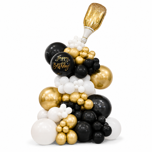 Champagne balloon arrangement Toronto with black, white and gold birthday balloons by Wooow Balloons.