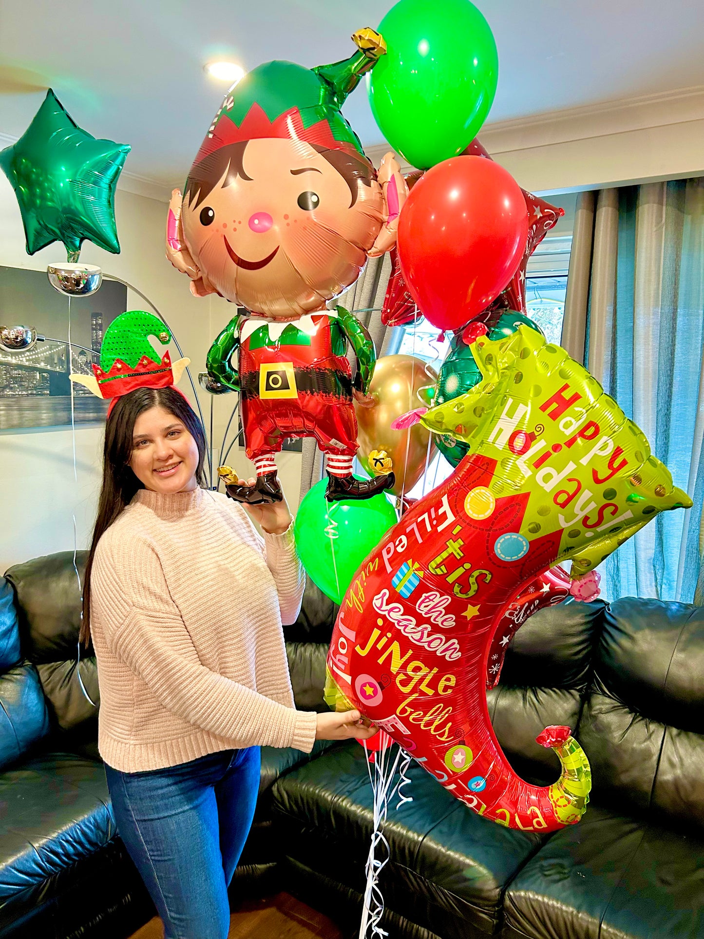 Festive Christmas balloon bouquet with elf foil balloon and holiday stocking design, handcrafted for same-day Christmas balloon delivery in Toronto.