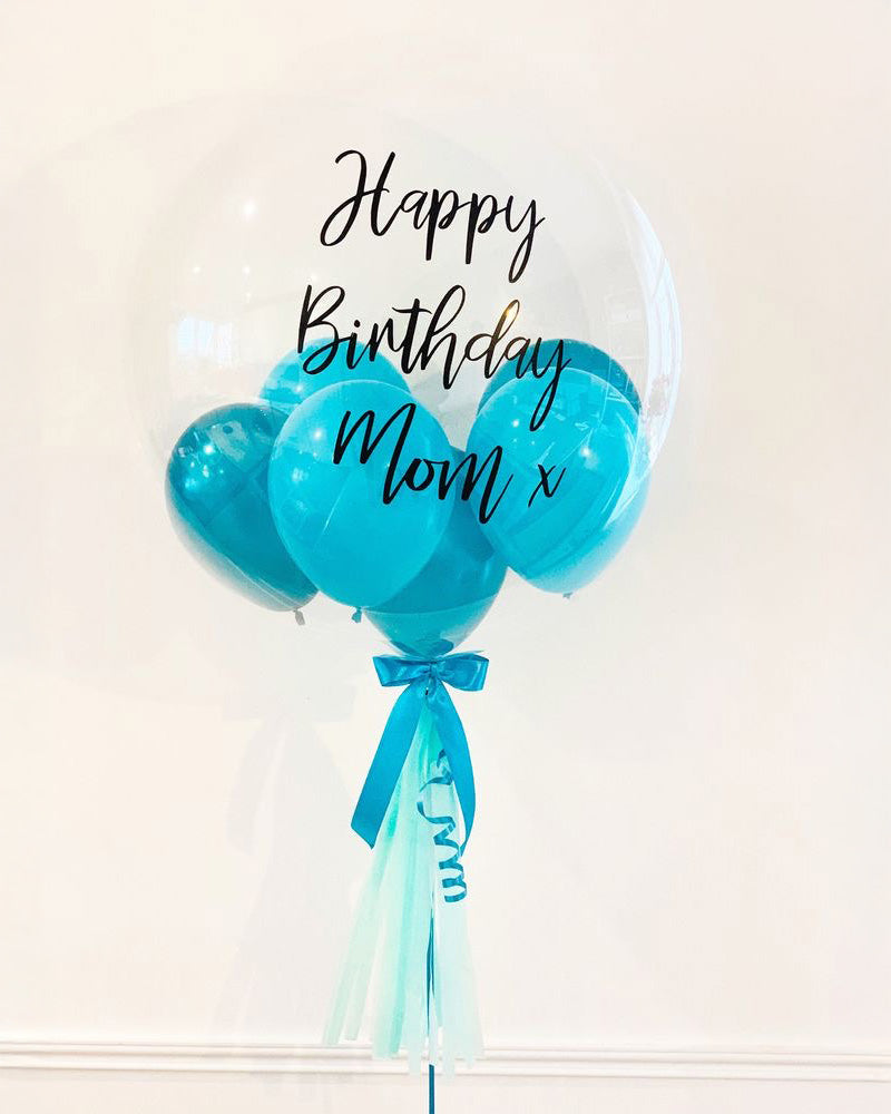 Clear Bubble Balloon with Message Toronto – personalized transparent balloon with teal mini balloons and ribbon by Wooow Balloons