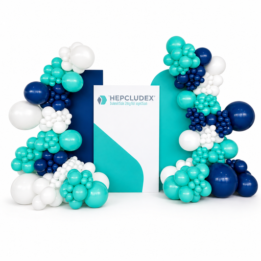 Balloon arch with blue, green, and white balloons in front of a Hepcludex product box.