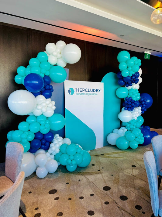 Balloon garland and custom printed backdrop for corporate event in Toronto